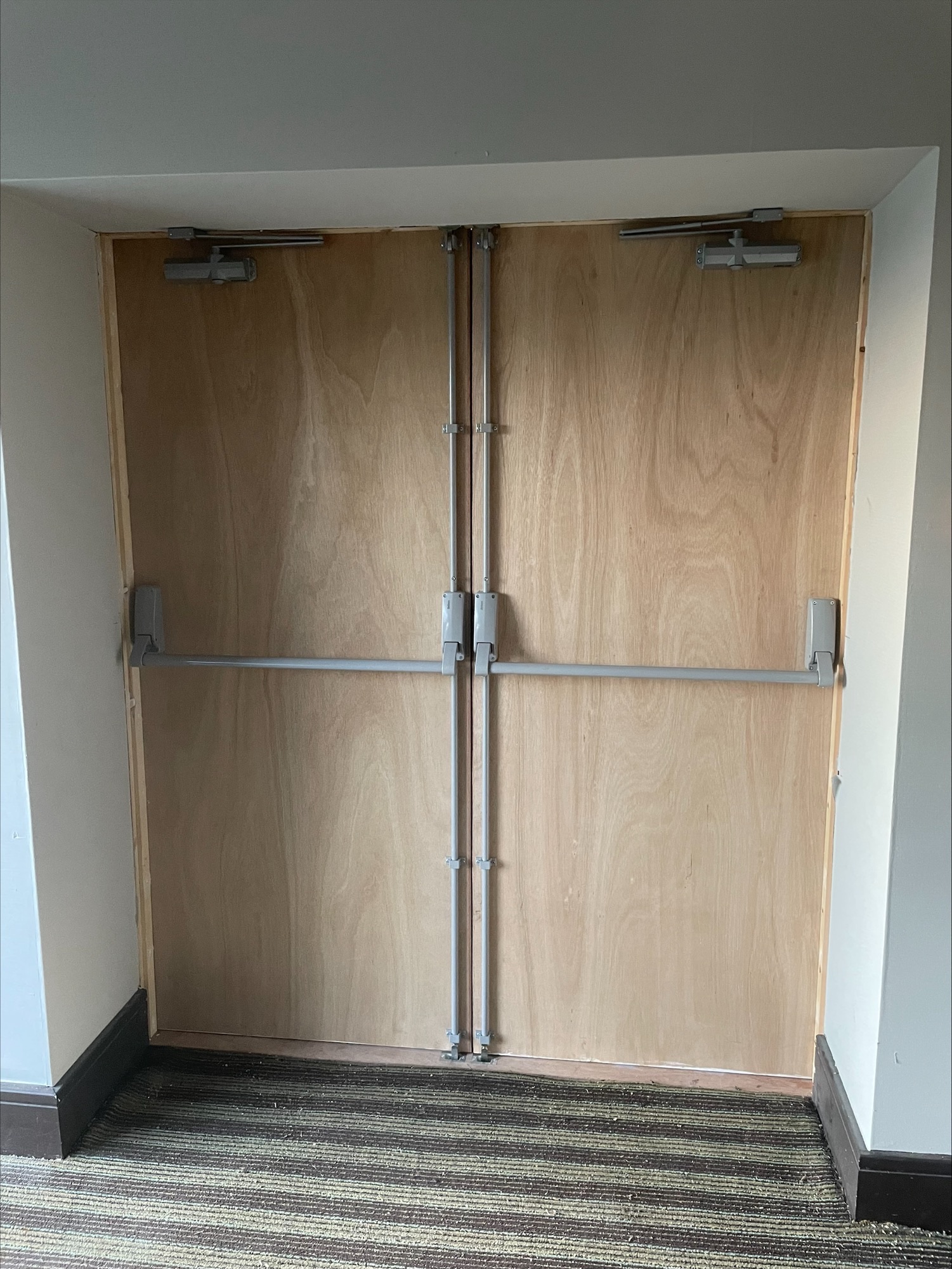 A double exit fire door. With panic bolts for emergency exit. supplied and fitted by us in Swansea, Neath, port Talbot and South Wales